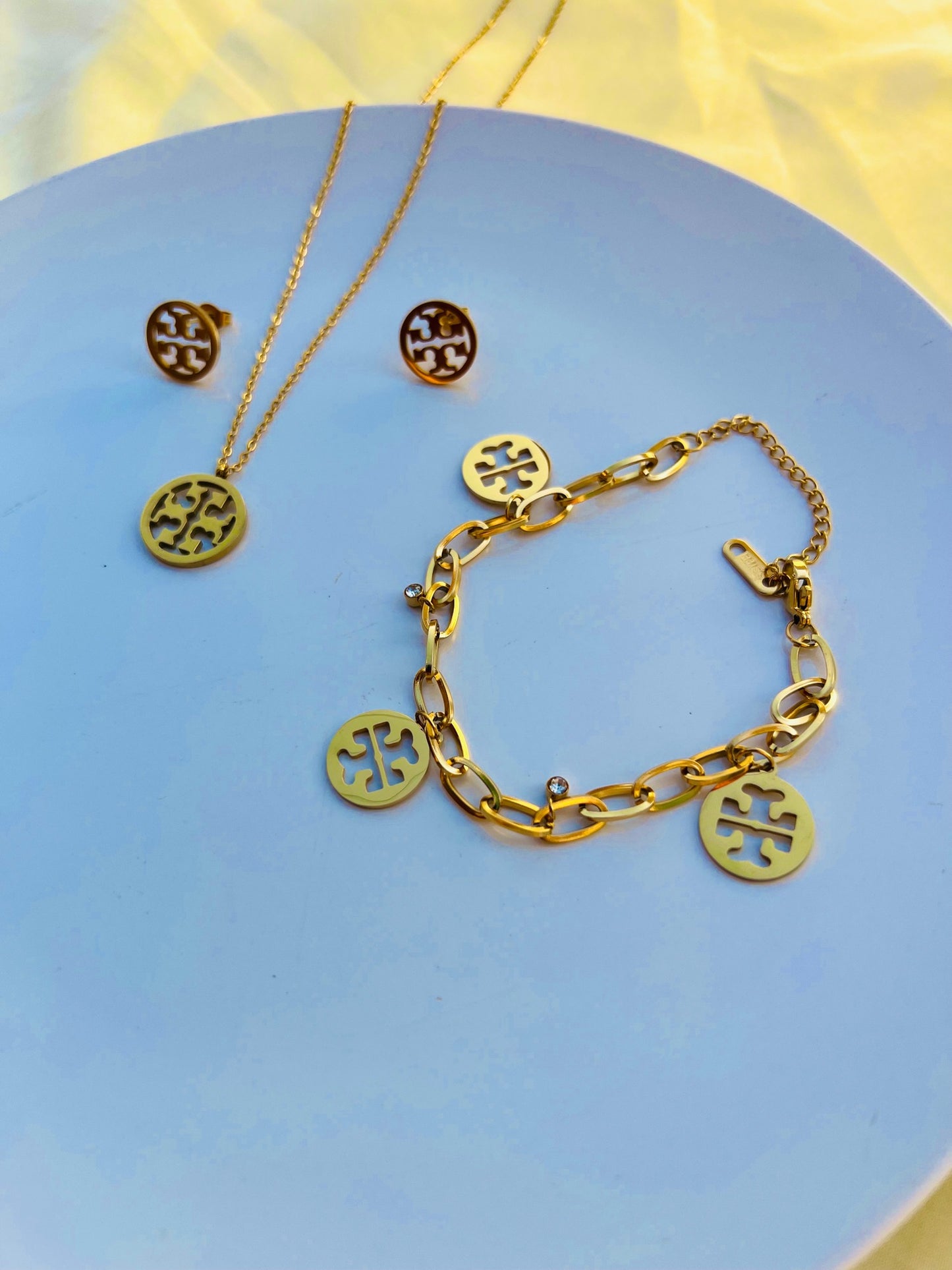 Tory pendant set premium quality stainless steel material gold colour with tops